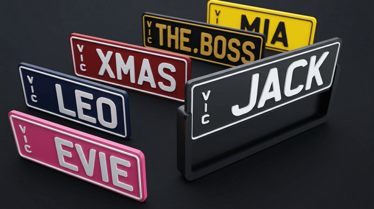 Custom JACK plate in a sheath holder surrounded by colourful swappable plates including EVIE, LEO, MIA, XMAS, and THE BOSS